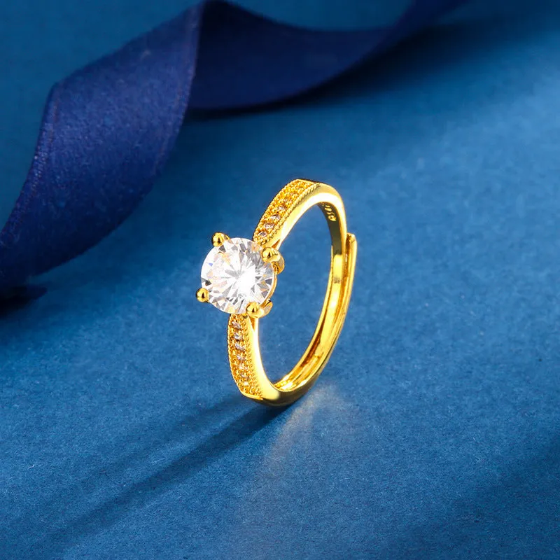 Classic four-claw ring with 1 karat eight hearts eight arrows zircon in gold colour on white background
