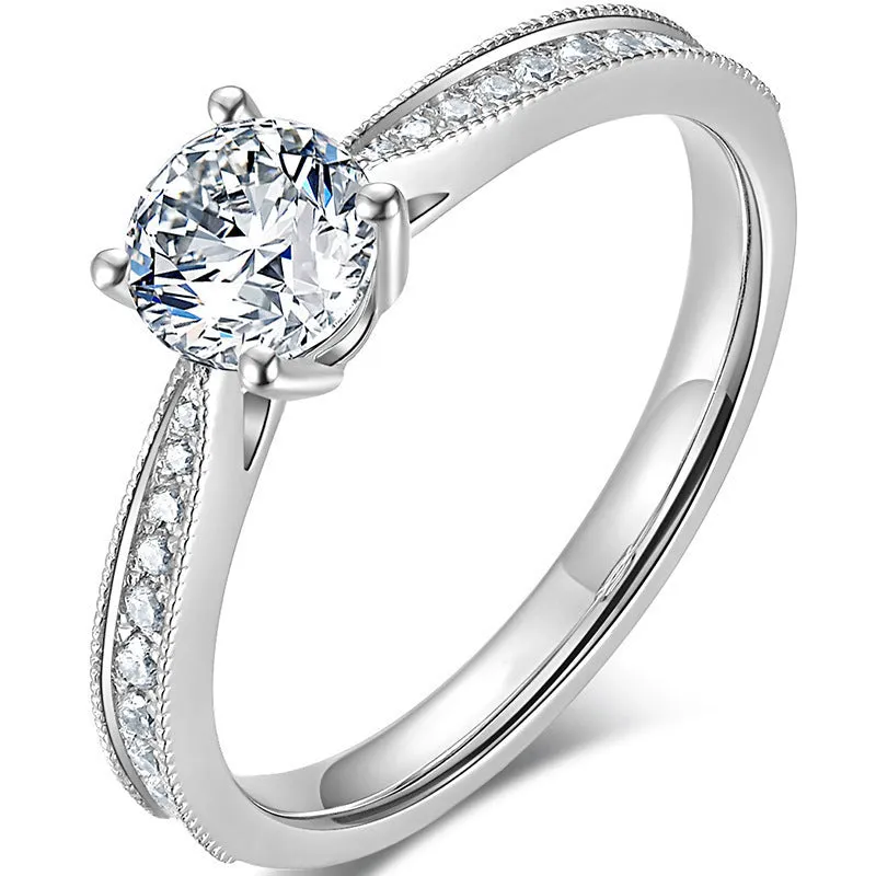 Classic four-claw ring with 1 karat eight hearts eight arrows zircon in gold colour on white background