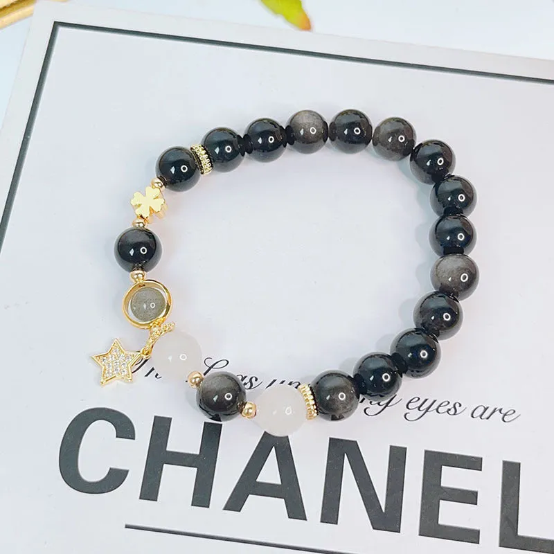 Women's silverstone charm bracelet with electroplated finish showing floral, heart, and star design options