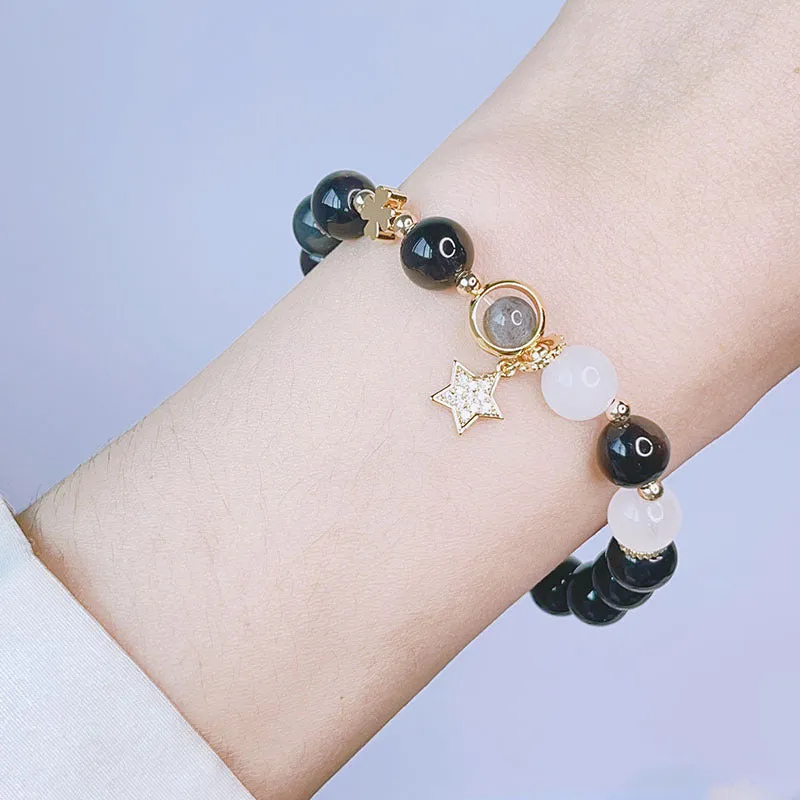 Women's silverstone charm bracelet with electroplated finish showing floral, heart, and star design options