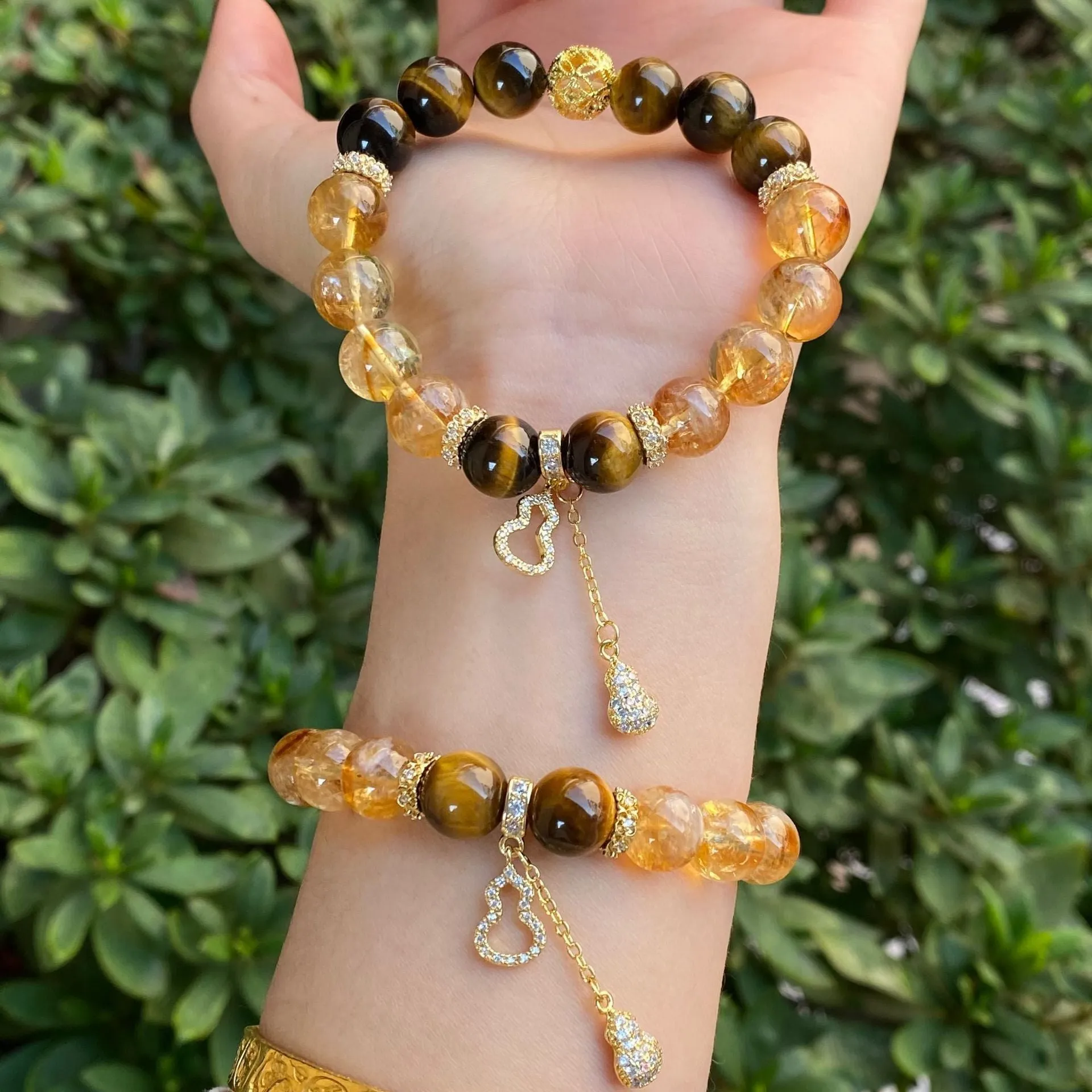 Handmade unisex crystal bracelet with diamond-studded gourd charm and mix of 8mm and 10mm prayer wheel, topaz, and disc beads.