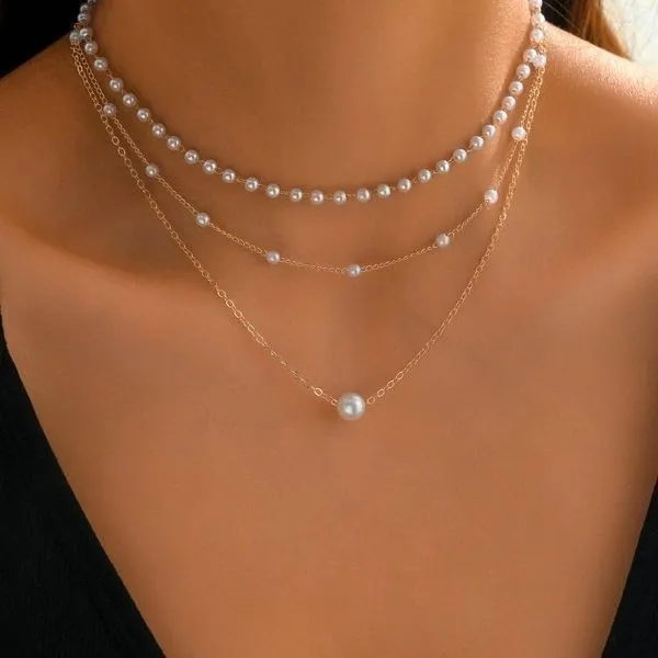Three-layer gold imitation pearl necklace with twin pendant leaf U-shaped geometric design