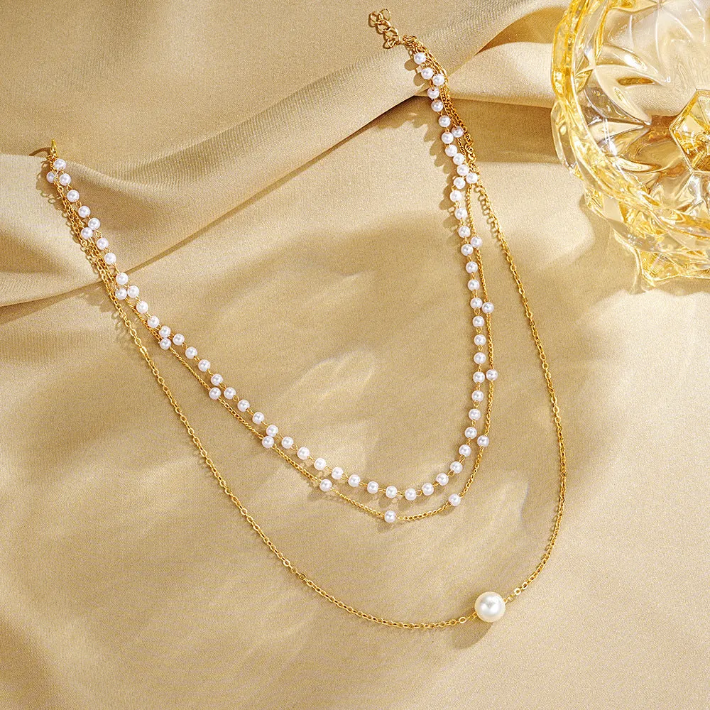 Three-layer gold imitation pearl necklace with twin pendant leaf U-shaped geometric design