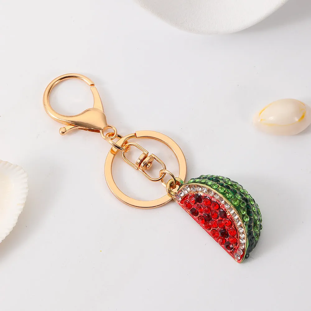 Creative watermelon shape metal car keychain in red on a white background