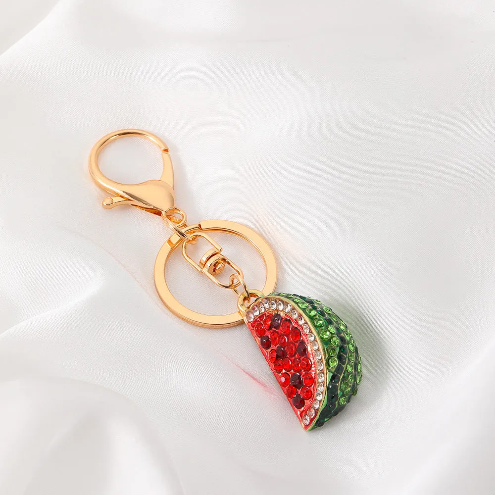 Creative watermelon shape metal car keychain in red on a white background