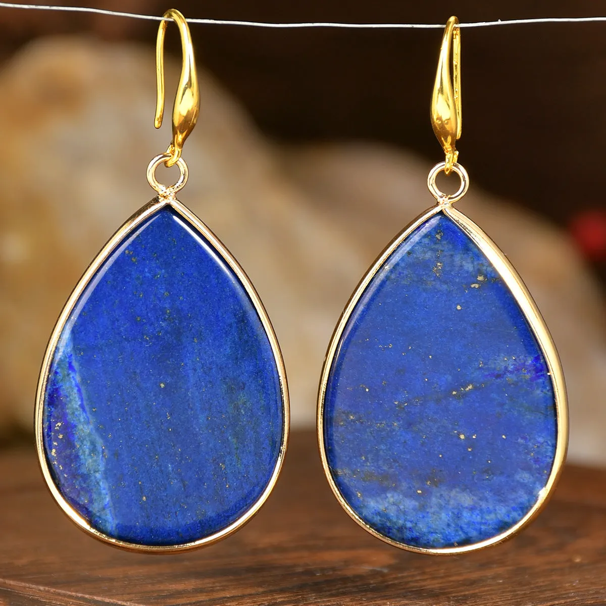 Women's retro-style drop earrings with a natural stone pendant in green aventurine on electroplated settings.