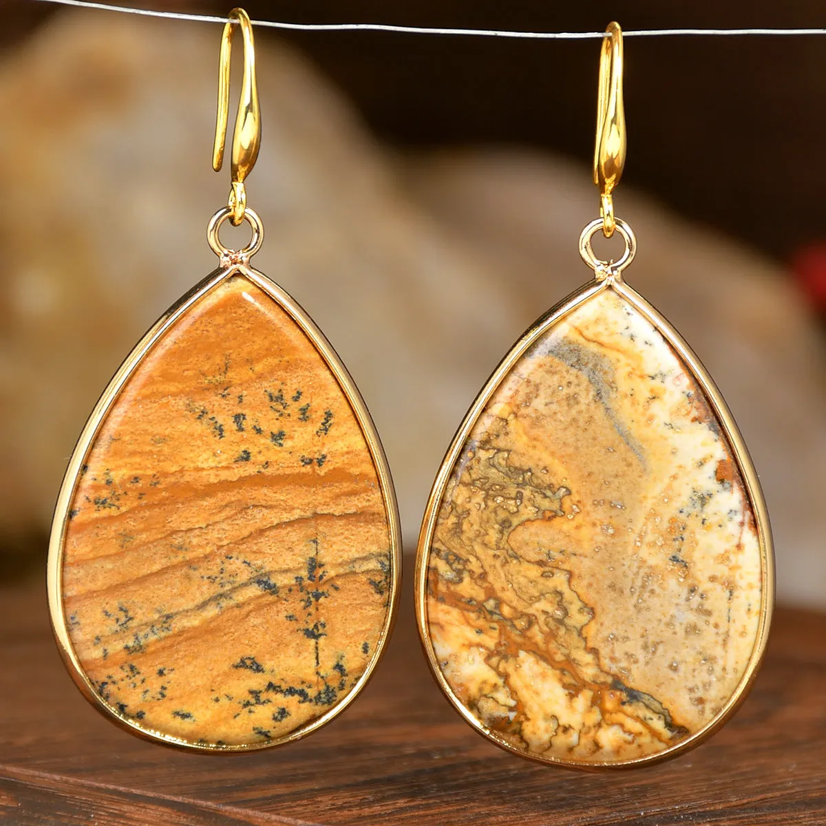 Women's retro-style drop earrings with a natural stone pendant in green aventurine on electroplated settings.