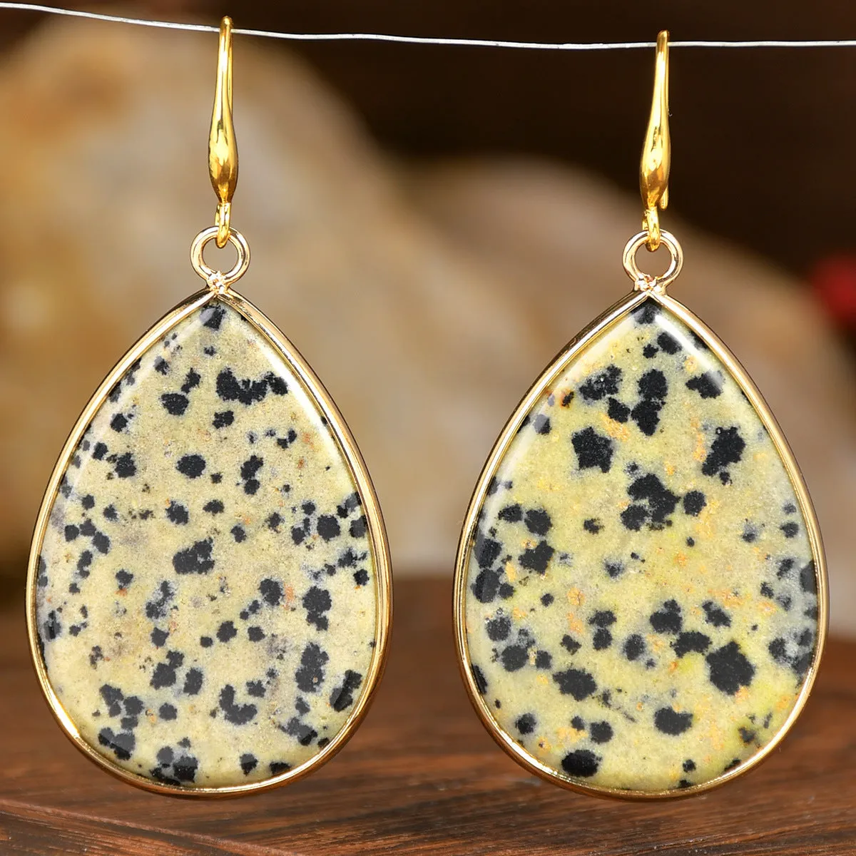 Women's retro-style drop earrings with a natural stone pendant in green aventurine on electroplated settings.