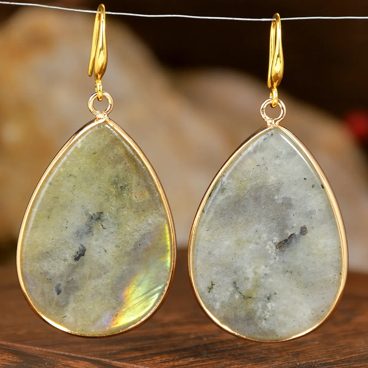 Women's retro-style drop earrings with a natural stone pendant in green aventurine on electroplated settings.