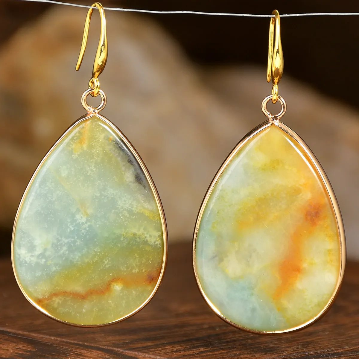 Women's retro-style drop earrings with a natural stone pendant in green aventurine on electroplated settings.
