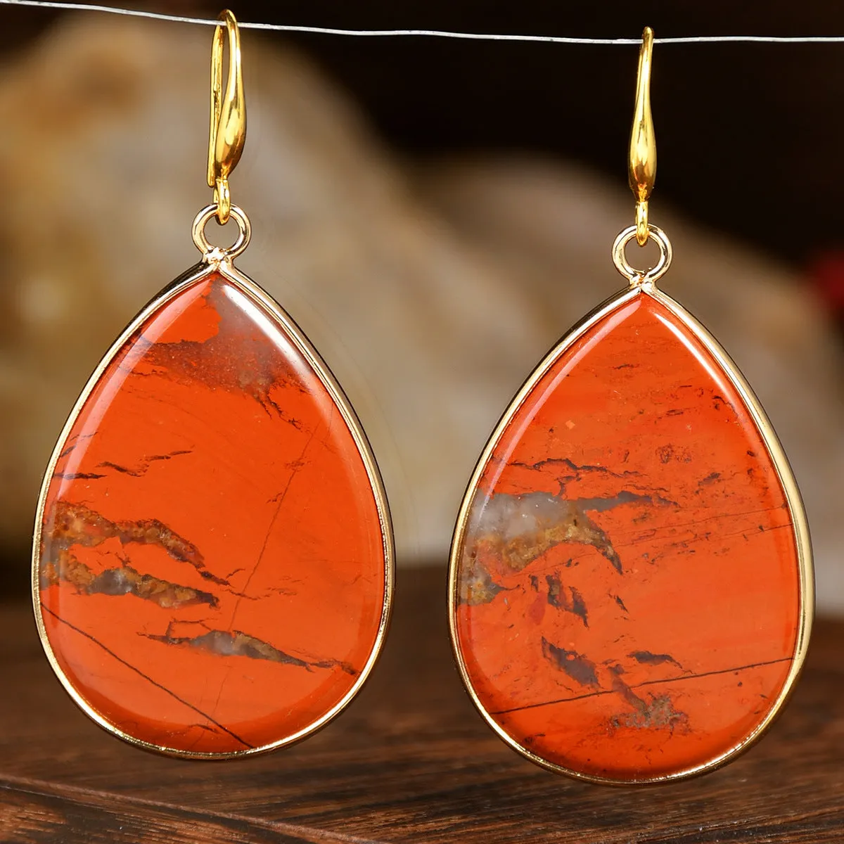Women's retro-style drop earrings with a natural stone pendant in green aventurine on electroplated settings.