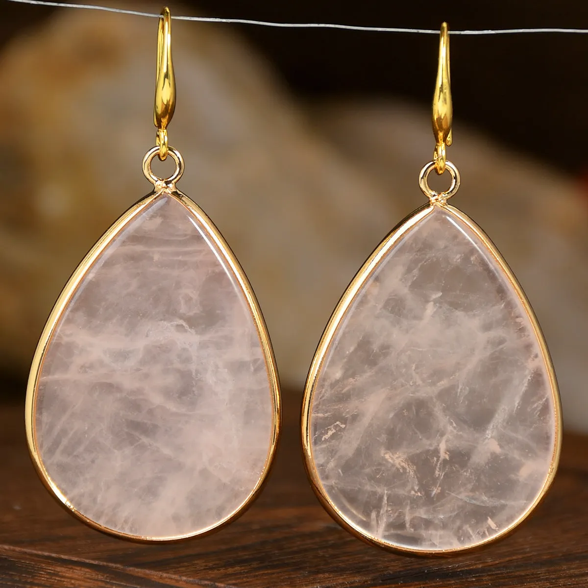 Women's retro-style drop earrings with a natural stone pendant in green aventurine on electroplated settings.