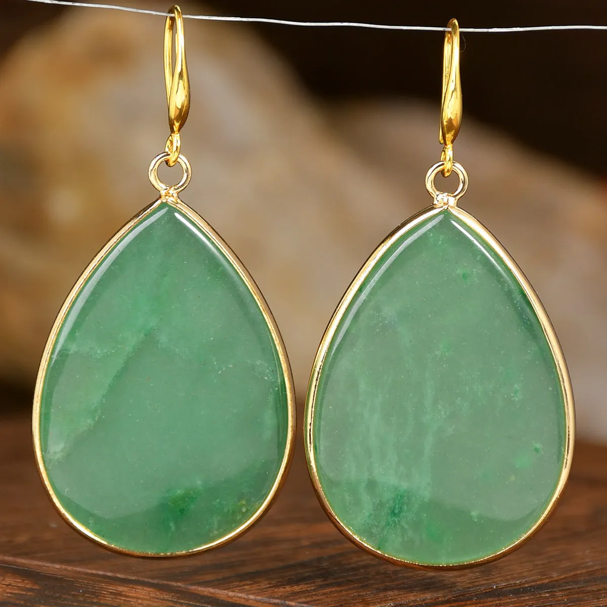 Women's retro-style drop earrings with a natural stone pendant in green aventurine on electroplated settings.