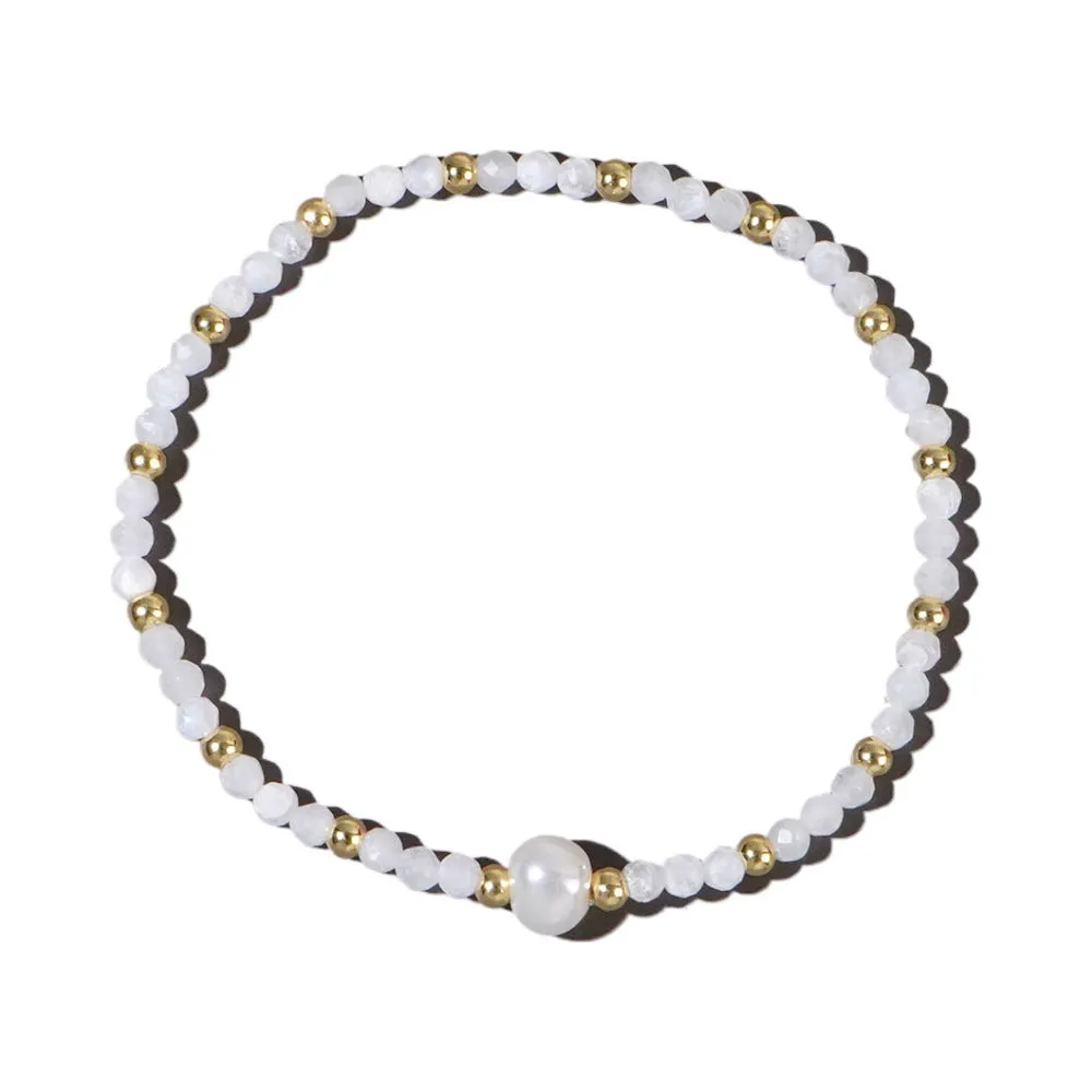 A unisex natural stone bracelet with elliptical geometric beads on a wrist, shown in one of the multiple available colours.