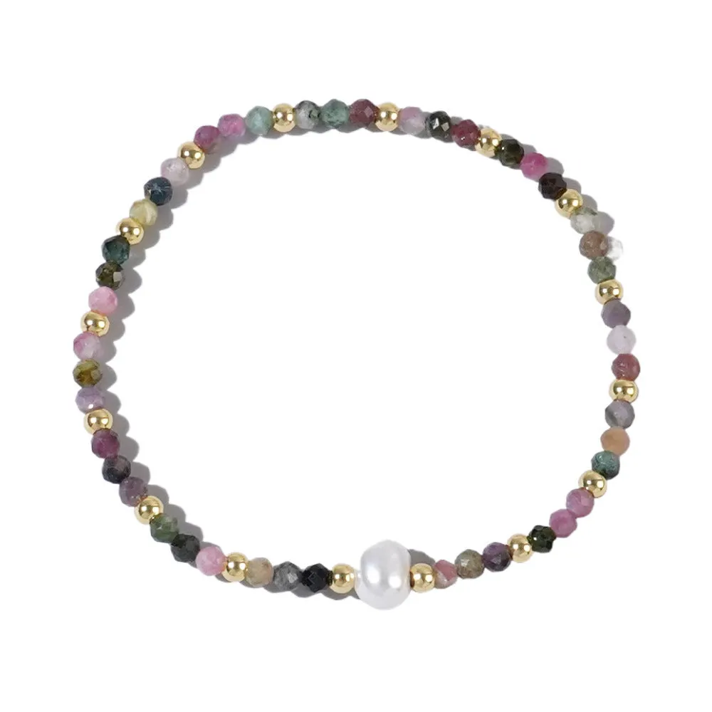 A unisex natural stone bracelet with elliptical geometric beads on a wrist, shown in one of the multiple available colours.