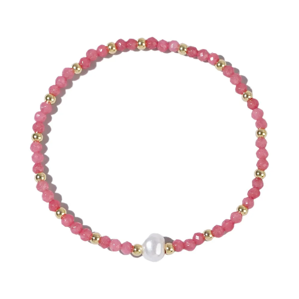 A unisex natural stone bracelet with elliptical geometric beads on a wrist, shown in one of the multiple available colours.