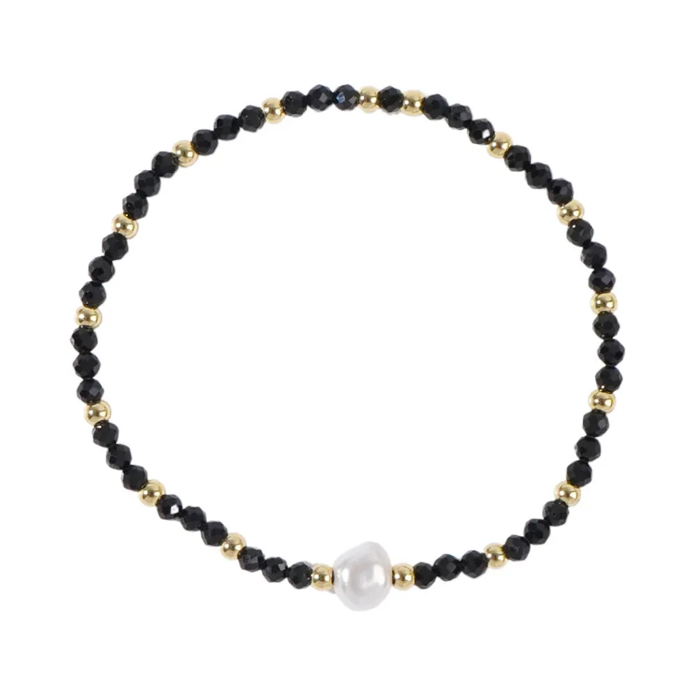 A unisex natural stone bracelet with elliptical geometric beads on a wrist, shown in one of the multiple available colours.