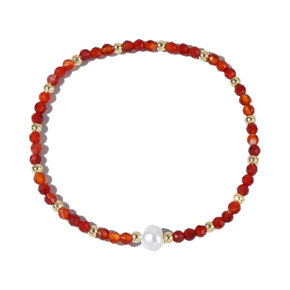 A unisex natural stone bracelet with elliptical geometric beads on a wrist, shown in one of the multiple available colours.