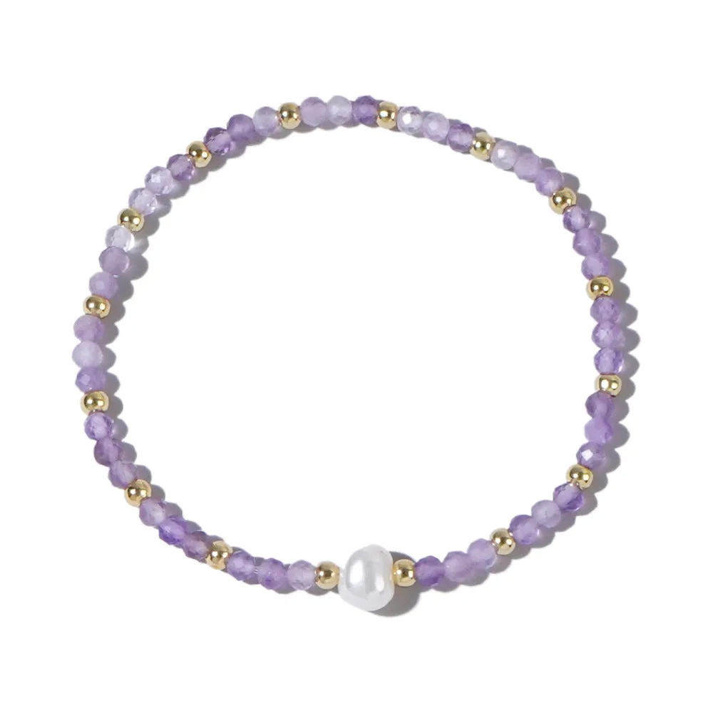 A unisex natural stone bracelet with elliptical geometric beads on a wrist, shown in one of the multiple available colours.