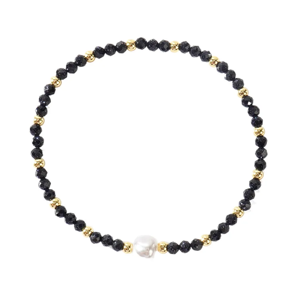 A unisex natural stone bracelet with elliptical geometric beads on a wrist, shown in one of the multiple available colours.