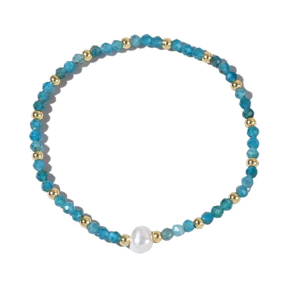 A unisex natural stone bracelet with elliptical geometric beads on a wrist, shown in one of the multiple available colours.