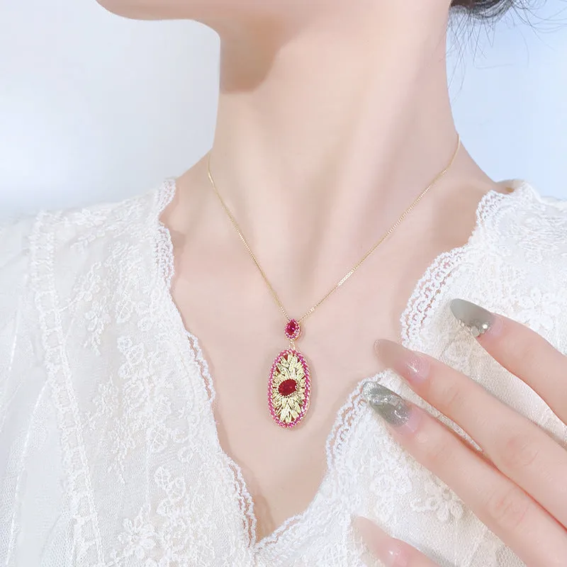 Gold-plated red corundum jewellery set showing necklace, ring and ear studs with diamond-cut water drop design