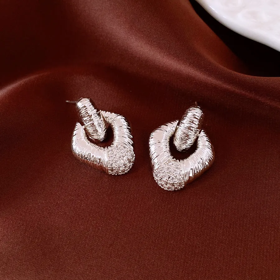 Copper diamond stud earrings with quadrilateral shape and silver needle finish for women