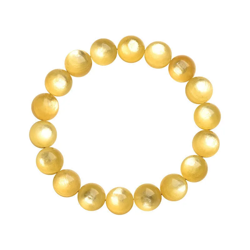 Yellow golden dragon mica bracelet with polished round geometric beads on wrist