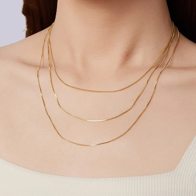 S925 sterling silver box chain necklace in silver colour, 40cm length on flat surface