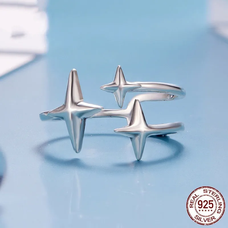 S925 sterling silver shining star open ring with polished finish and adjustable opening on a plain background