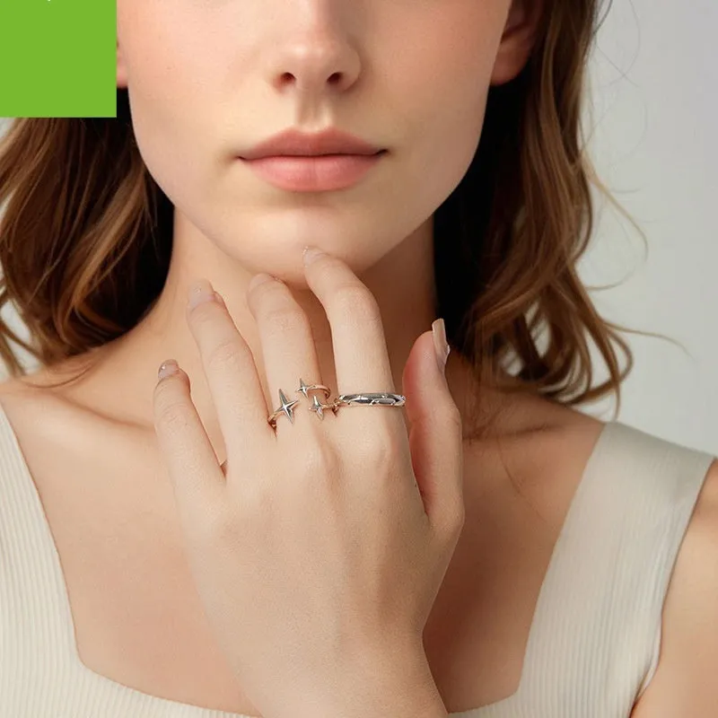 S925 sterling silver shining star open ring with polished finish and adjustable opening on a plain background