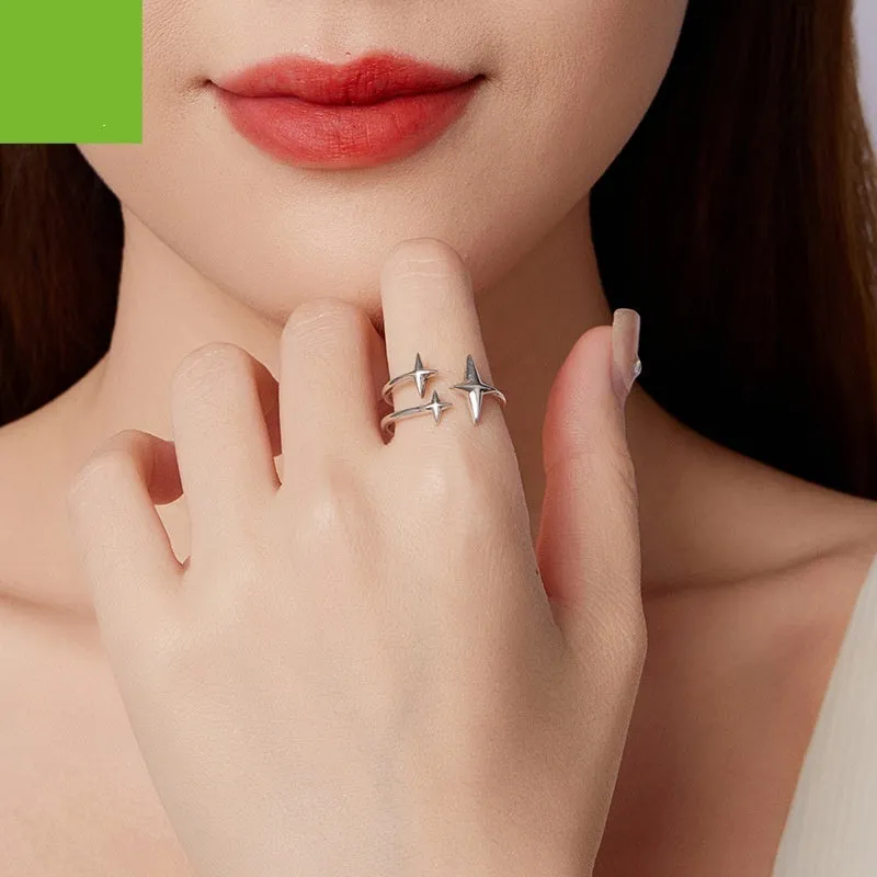S925 sterling silver shining star open ring with polished finish and adjustable opening on a plain background