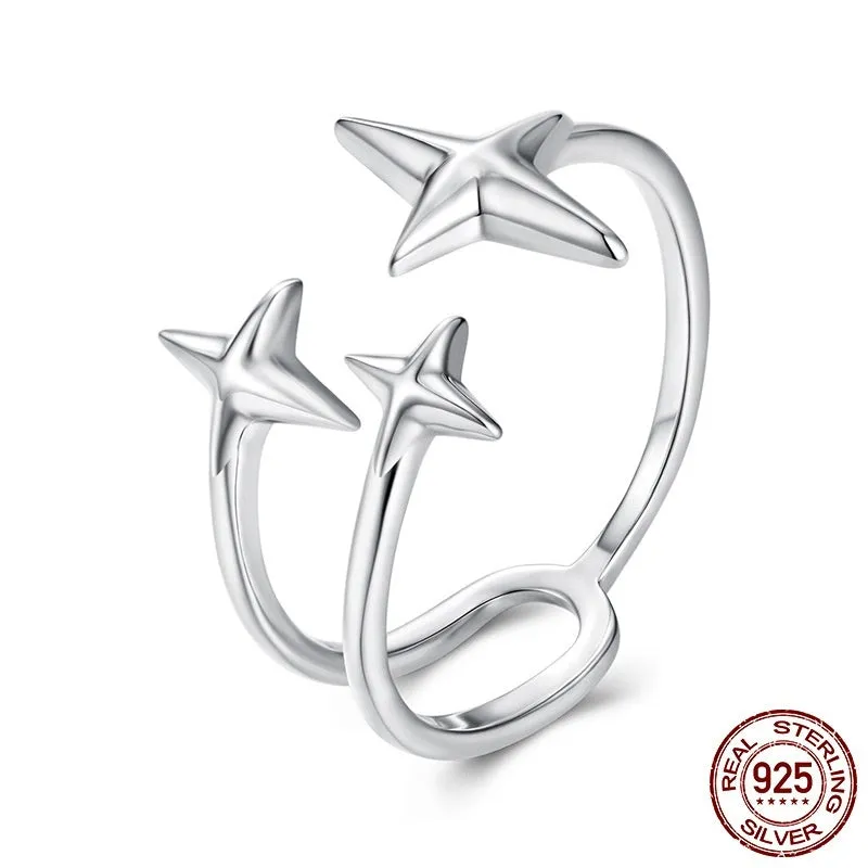 S925 sterling silver shining star open ring with polished finish and adjustable opening on a plain background