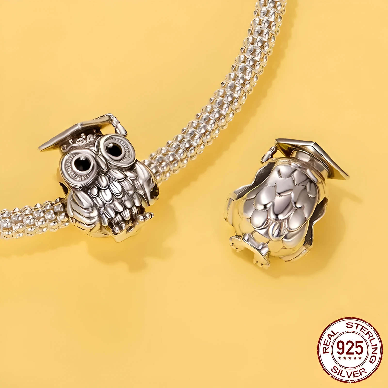 Silver S925 sterling silver owl bead with drip oil finish on white background