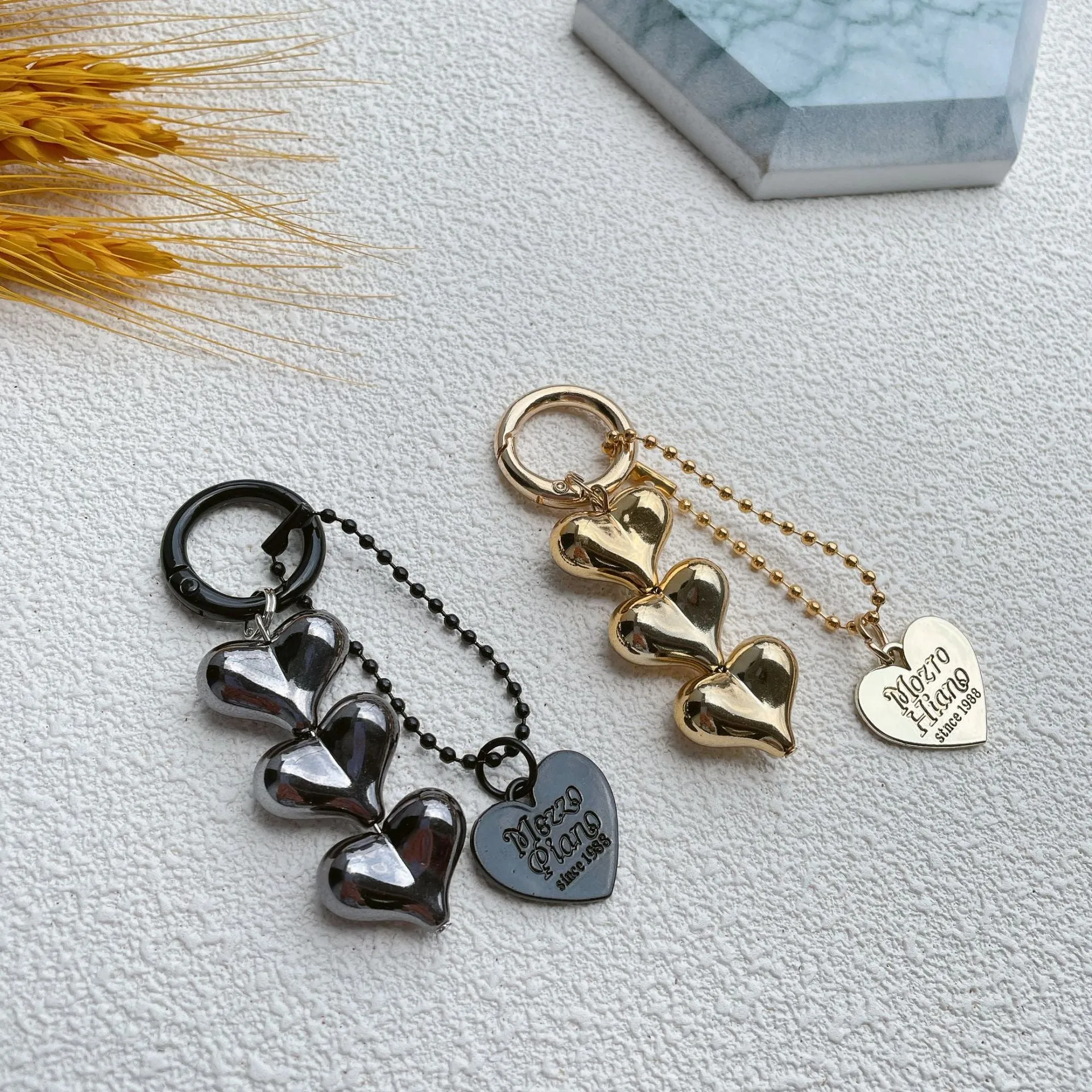 Love heart shaped acrylic charm keychain on an electroplated metal ring in silver finish.
