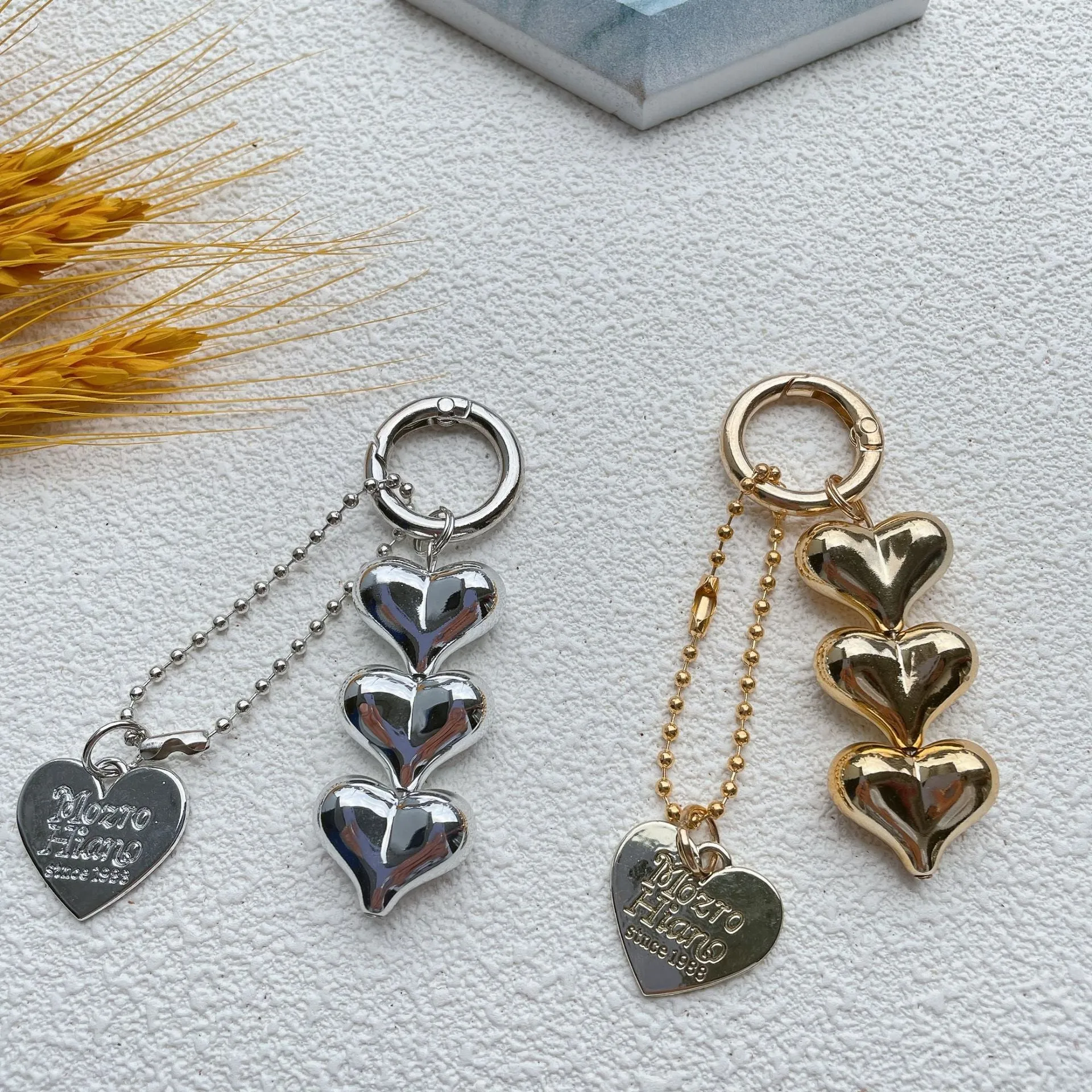 Love heart shaped acrylic charm keychain on an electroplated metal ring in silver finish.