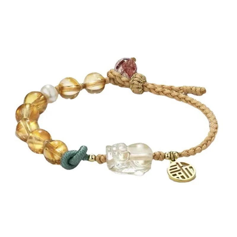 Hand-woven crystal bracelet with animal zodiac design in citrine colour