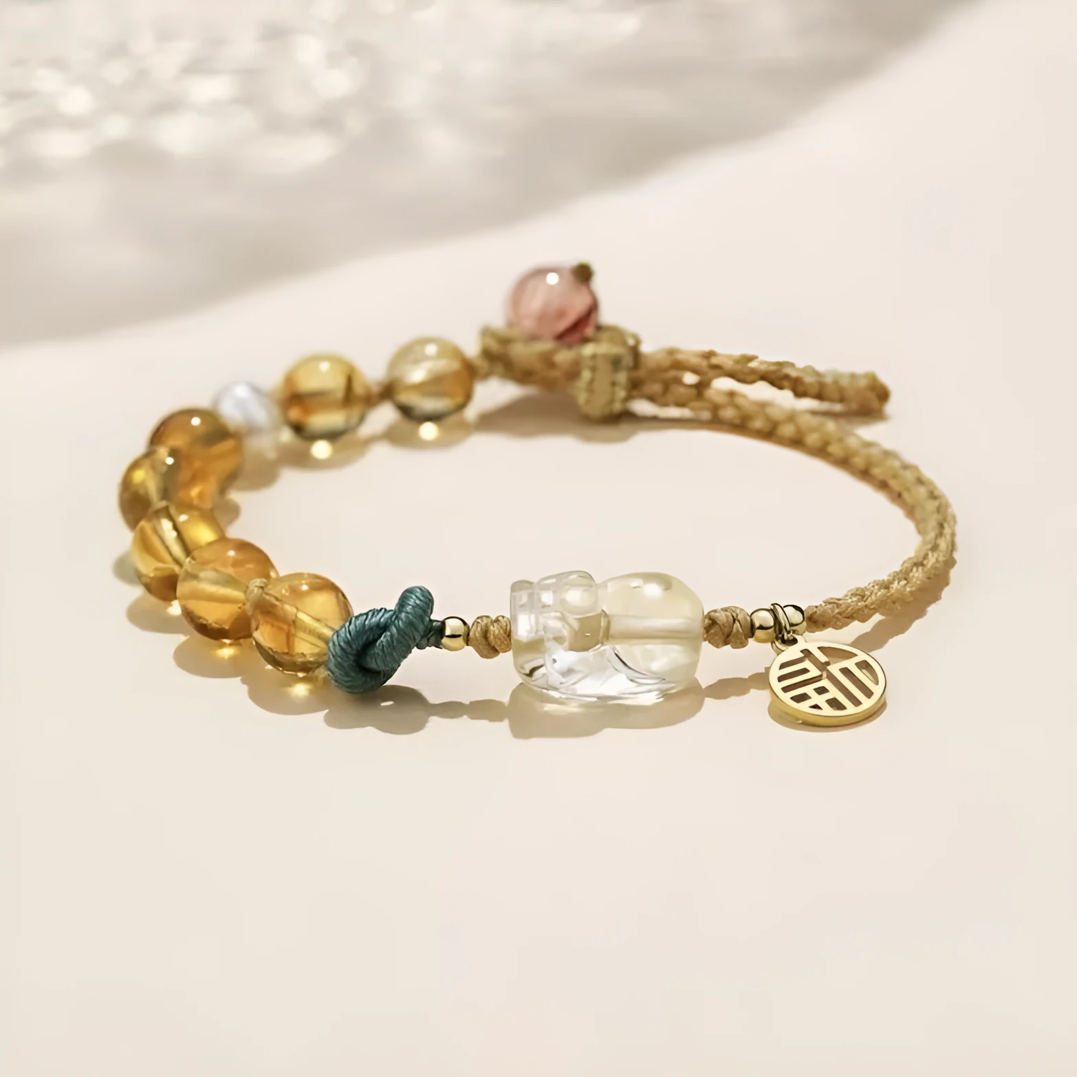 Hand-woven crystal bracelet with animal zodiac design in citrine colour