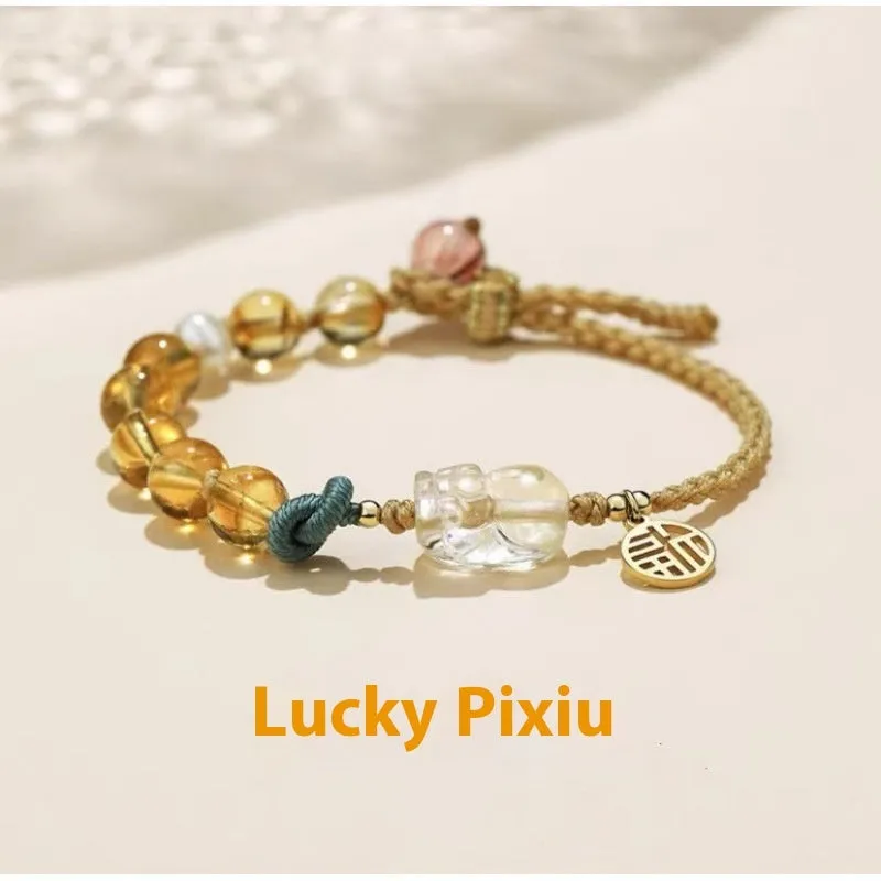 Hand-woven crystal bracelet with animal zodiac design in citrine colour