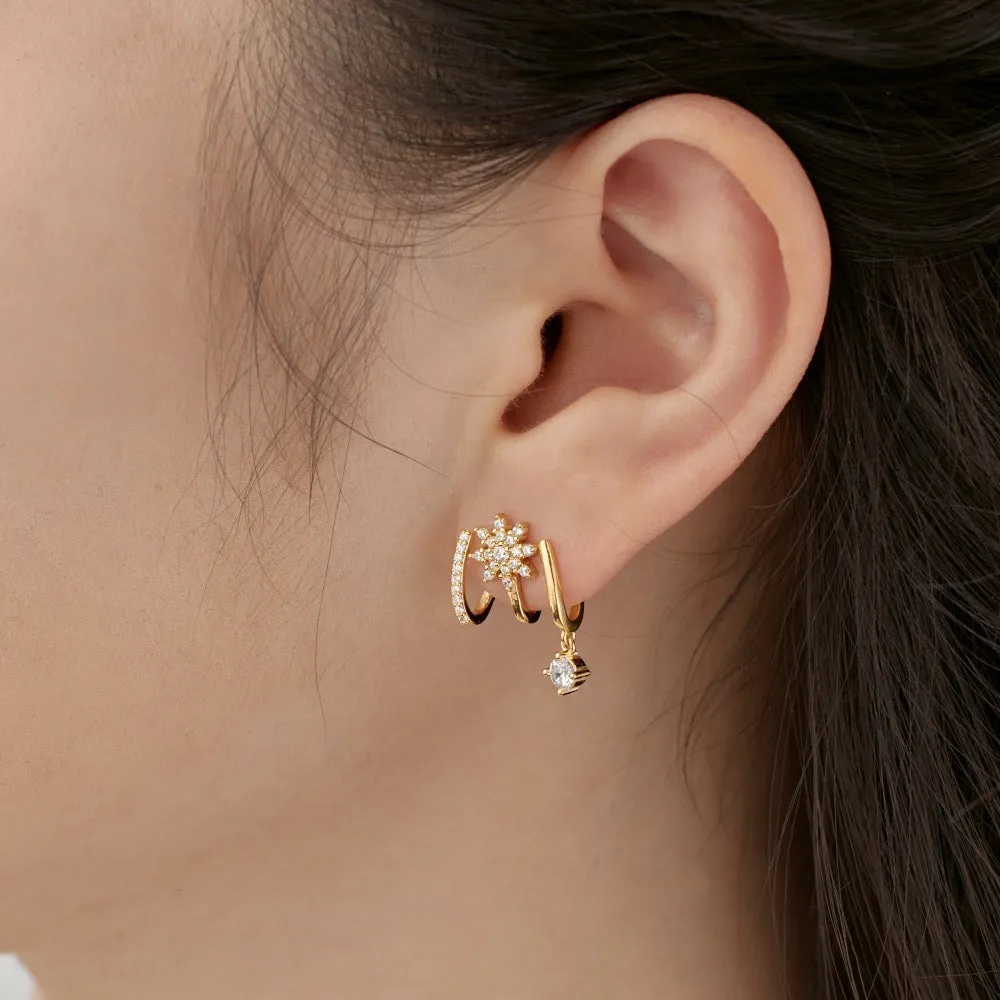 S925 sterling silver snowflake stud earrings in platinum finish with electroplated surface on white background