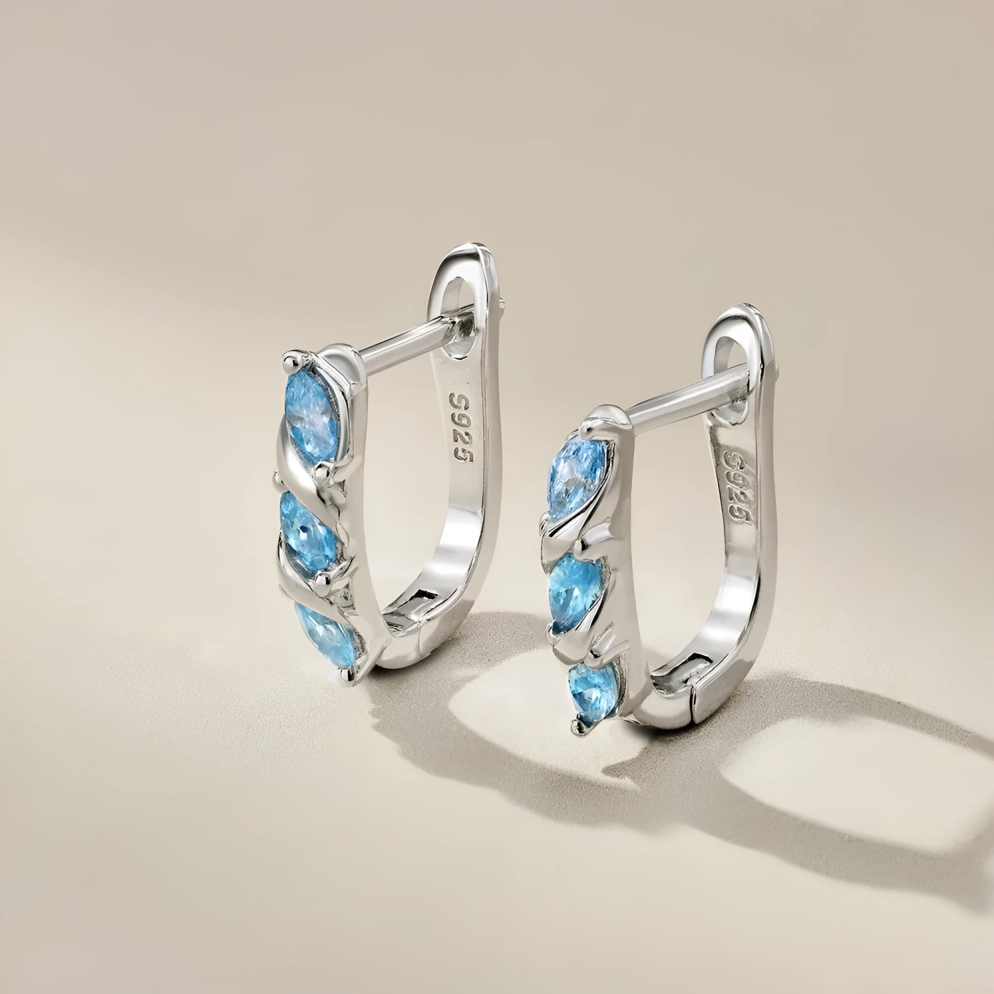 925 silver women's earrings with blue zircon inlay and platinum blue diamond electroplated finish in compact 3x14x15mm size.