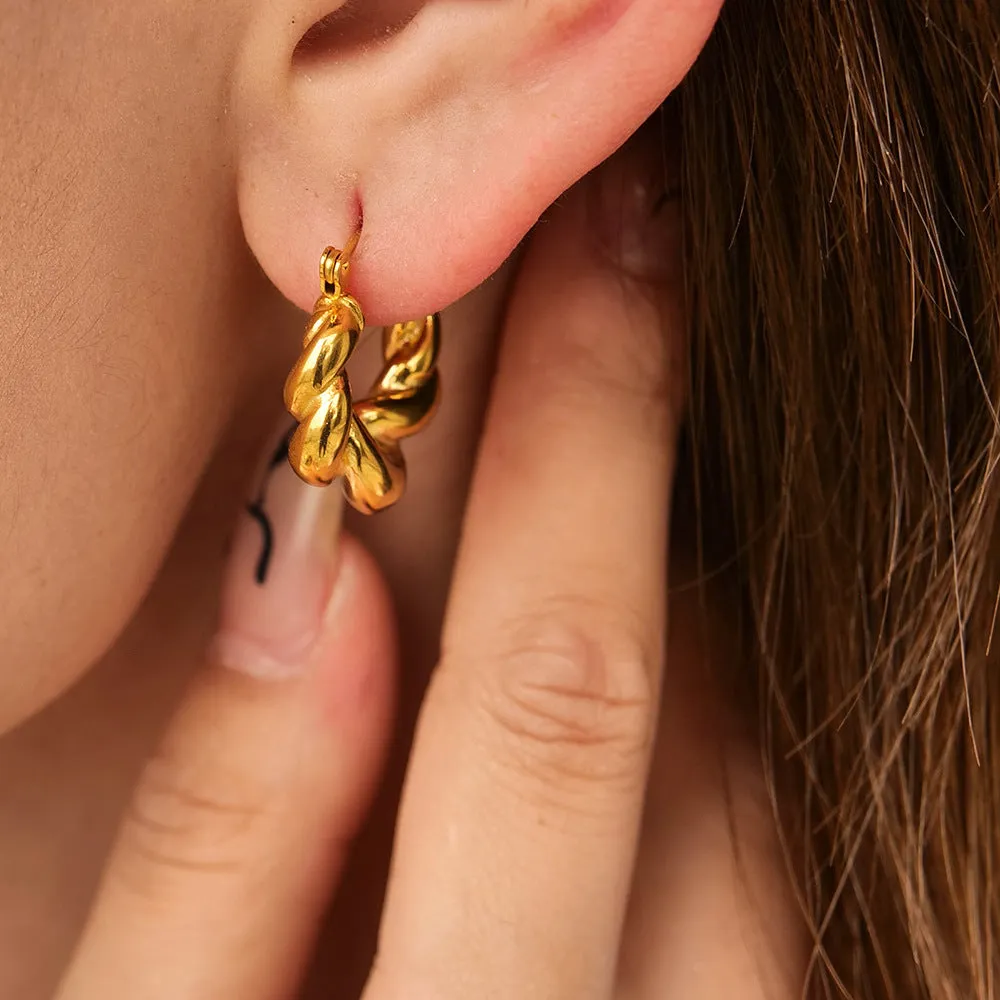 18K gold titanium steel geometric ellipse ear clip for women, light luxury style, on a model