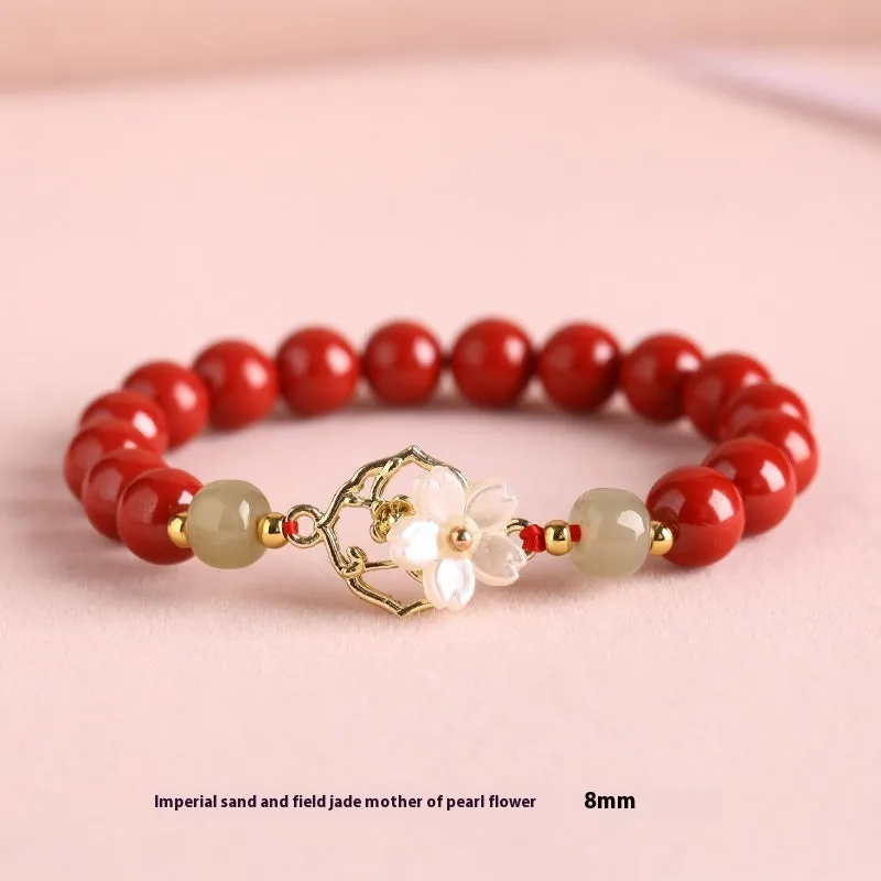 Cinnabar bracelet with Hetian Jade lotus charm and Bells of Ireland accents in New Chinese style