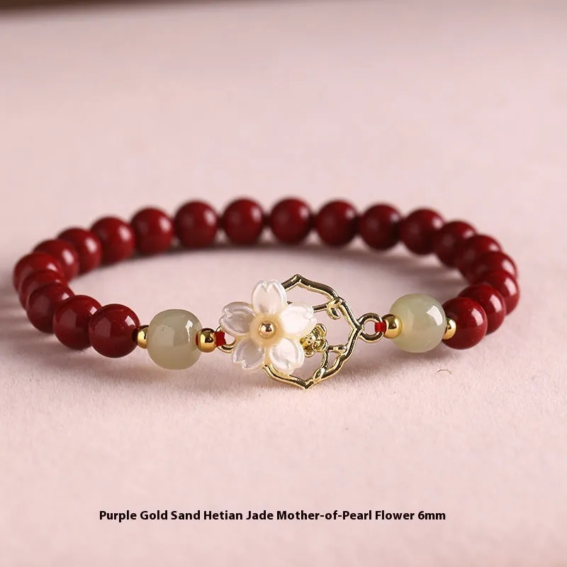 Cinnabar bracelet with Hetian Jade lotus charm and Bells of Ireland accents in New Chinese style