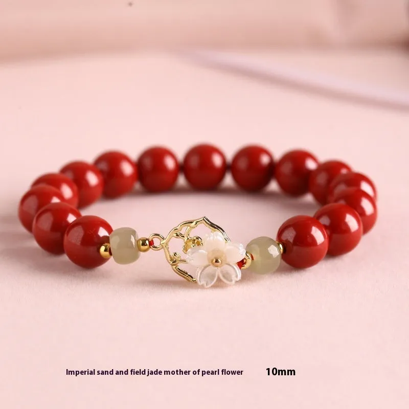 Cinnabar bracelet with Hetian Jade lotus charm and Bells of Ireland accents in New Chinese style