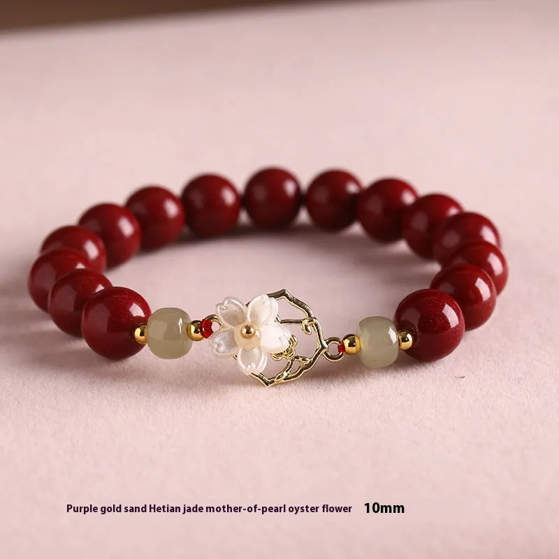 Cinnabar bracelet with Hetian Jade lotus charm and Bells of Ireland accents in New Chinese style