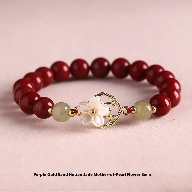 Cinnabar bracelet with Hetian Jade lotus charm and Bells of Ireland accents in New Chinese style