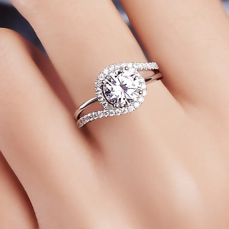 Diamond twist ring with small stones in white gold colour on copper base, adjustable opening