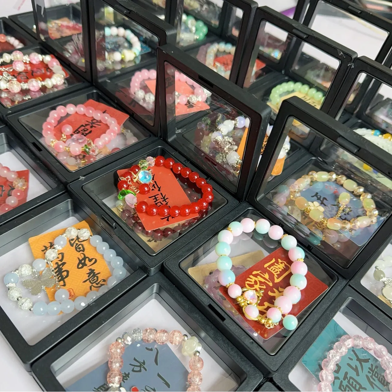 Coloured glaze Chinese bracelet with mixed materials in leaf, drop, and star shapes