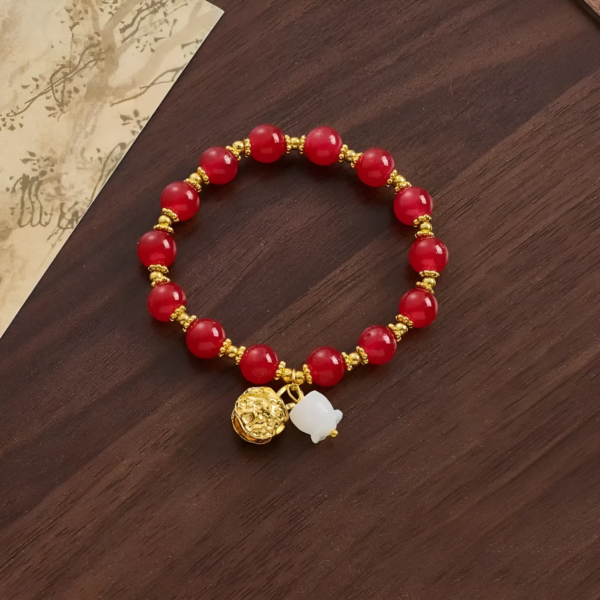 Coloured glaze Chinese bracelet with mixed materials in leaf, drop, and star shapes